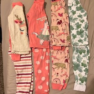 4 sets of pajamas size 2T and 24 months.